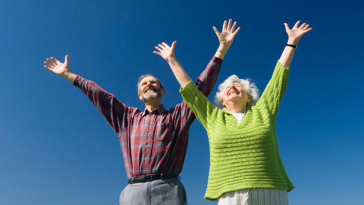 seniors raising their hands