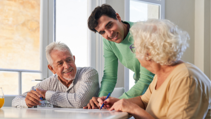 a young man talking with his senior parents