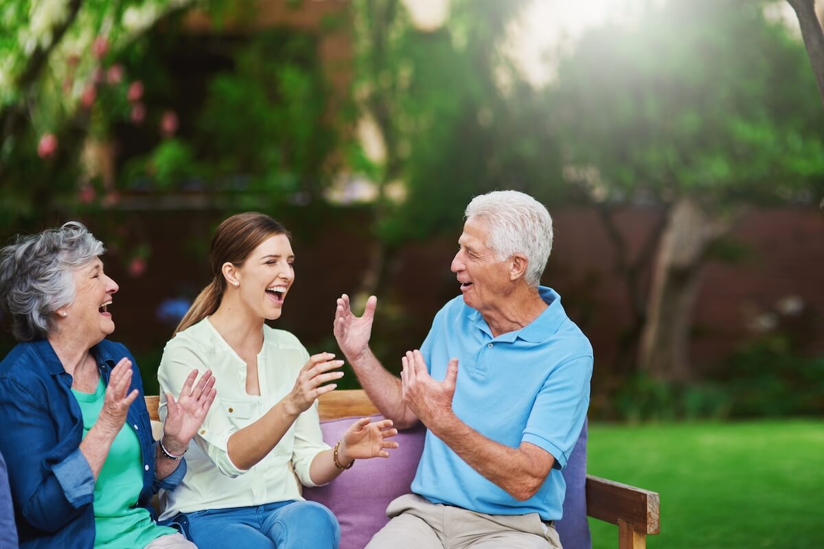 Shot of a senior couple spending time with their daughter