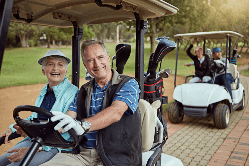 Couple, happy and drive golf cart for hobby, sports and recreation with weekend, bonding and fitness. Senior people, fun and romance on course for game, practice and club competition with leisure